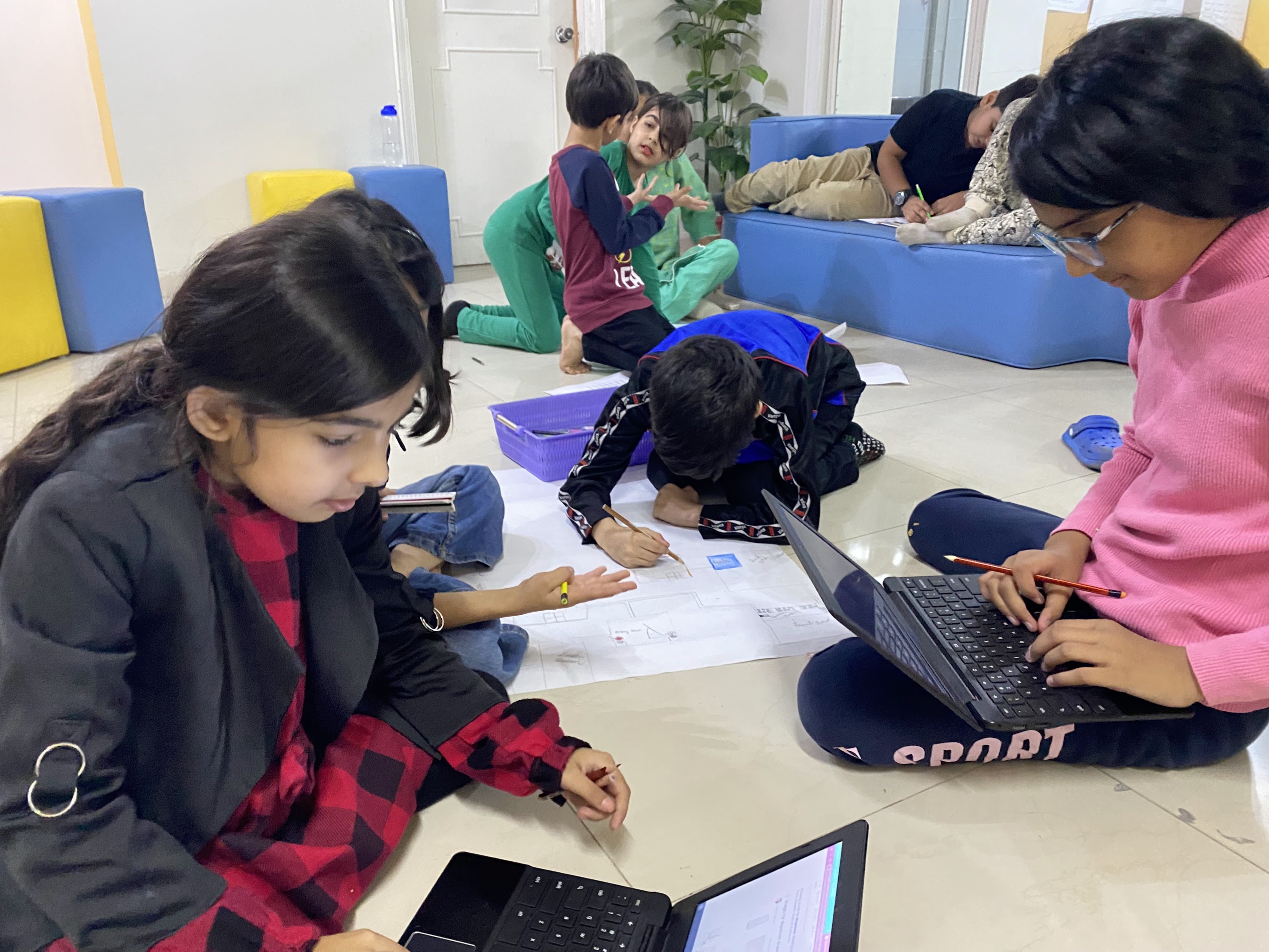 Elementary Studio students collaborating on hands-on project at Acton Academy Lahore